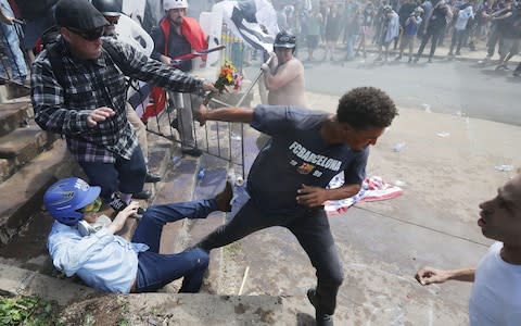 After clashes with anti-fascist protesters and police the rally was declared an unlawful gathering and people were forced out of Lee Park - Credit: GETTY