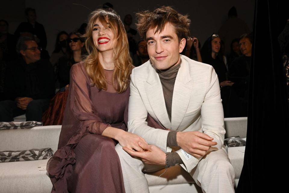 GIZA, EGYPT - DECEMBER 03: Suki Waterhouse and Robert Pattinson attend the Dior Fall 2023 Menswear Show on December 03, 2022 in Giza, Egypt. (Photo by Stephane Cardinale - Corbis/Corbis via Getty Images)