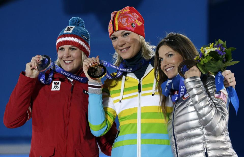Women's super combined medalists, from left, Nicole Hosp of Austria, silver, Maria Hoefl-Riesch of Germany, gold, and Julia Mancuso of the United States, bronze, pose with their medals at the 2014 Winter Olympics in Sochi, Russia, Monday, Feb. 10, 2014. (AP Photo/Morry Gash)