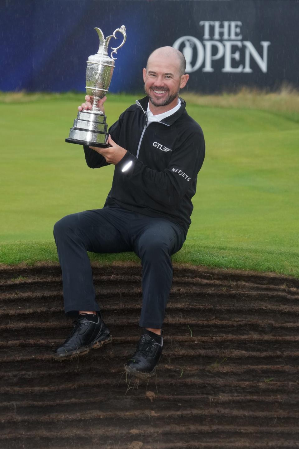 Brian Harman shows off the Claret Jug at Royal Liverpool on July 23, the prize for winning the British Open.