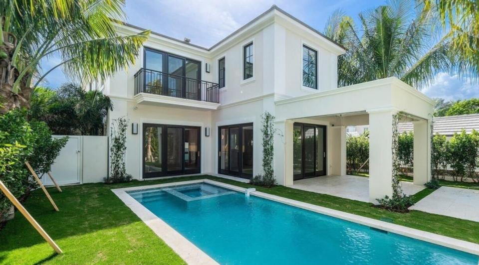 Glass doors, a balcony and a covered patio overlook the pool at 307 Chilean Ave., which just changed hands for a recorded $12 million in Palm Beach.