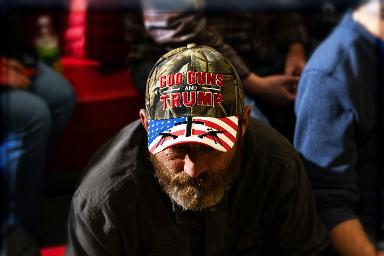 A supporter of Donald Trump wears a hat displaying a logo that is pro-guns and Trump Jim Vondruska/Getty Images