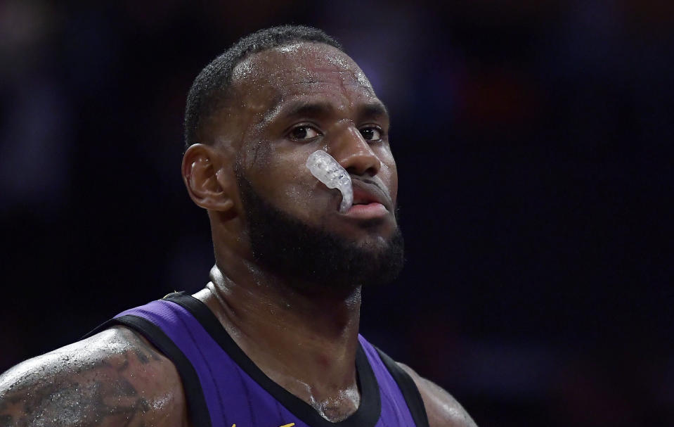 Los Angeles Lakers forward LeBron James paues during the closing seconds of the team's NBA basketball game against the Milwaukee Bucks on Friday, March 1, 2019, in Los Angeles. The Bucks won 131-120. (AP Photo/Mark J. Terrill)