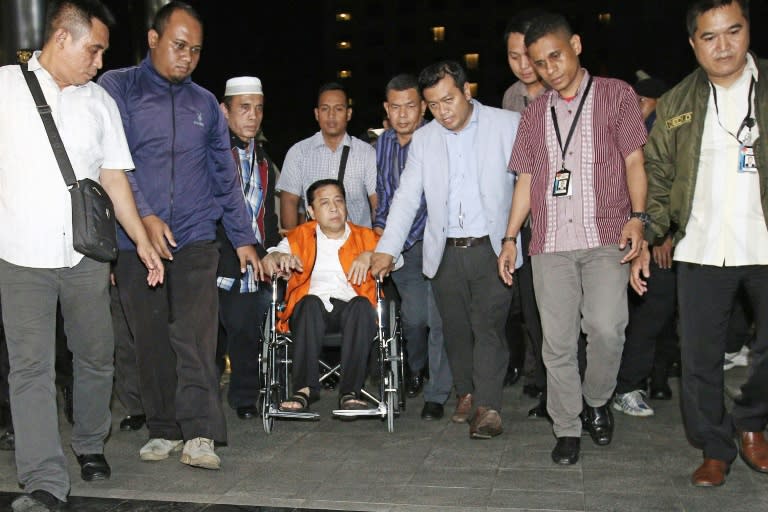 Indonesia's parliament speaker was moved in a wheelchair from hospital to a detention centre after being charged for his involvement in a graft scandal