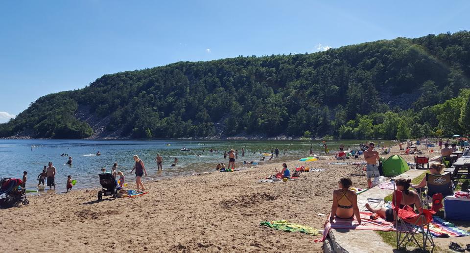 Devil's Lake is Wisconsin's most popular park. The beach on the lake's south shore, pictured here in 2017, is a popular spot for cooling off in the summer.