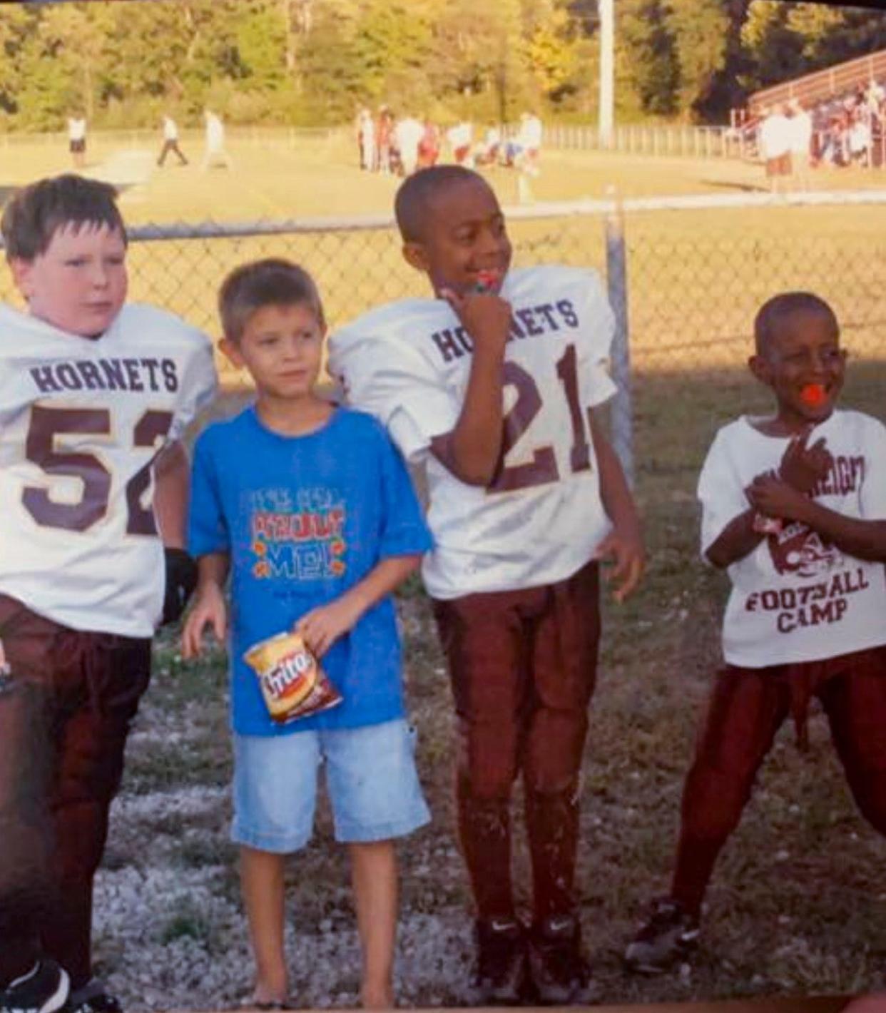 John Giannaris and Marcus McGee, the two in the center, met as classmates while attending a Licking Heights elementary school. The two remained friends despite going to different high schools, but later lost touch. The two were reunited while serving on the same aircraft carrier with the U.S. Navy.