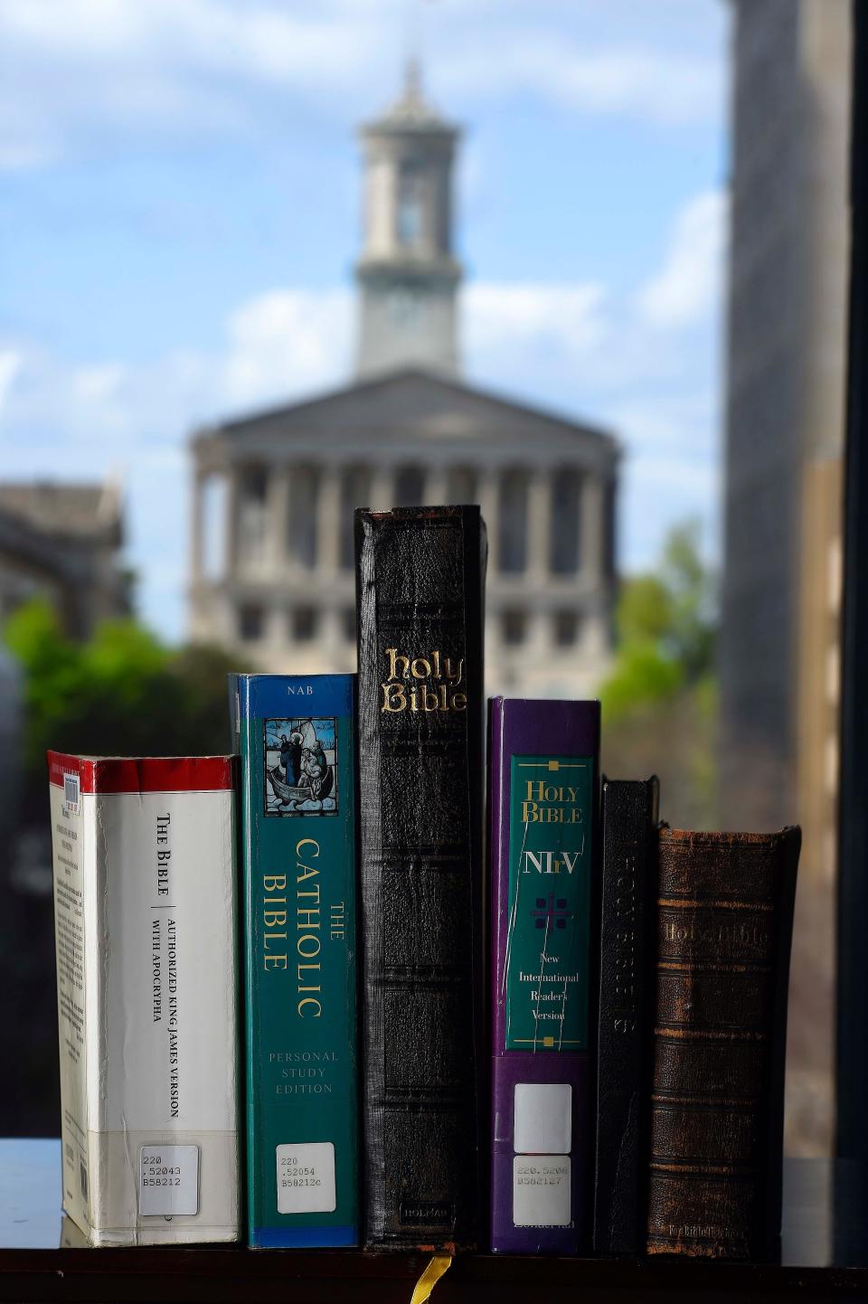 A set of Bibles at the Nashville Public Library, with the state Capitol in the background. In 2016, then-Gov. Bill Haslam vetoed a bill to make the Bible the official state book. Since then, there have been more efforts and in 2025, a Brentwood Republican wants to make the Aitken Bible — the first edition of the Bible printed in the U.S. during the Revolutionary War — an official state book, alongside a handful of other works.