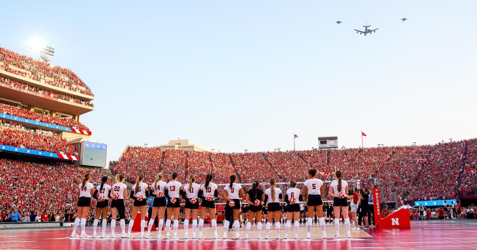 A KC-135 and three F-16 jets fly over Memorial Stadium during the national anthem before the match between the Nebraska Cornhuskers and the Omaha Mavericks.