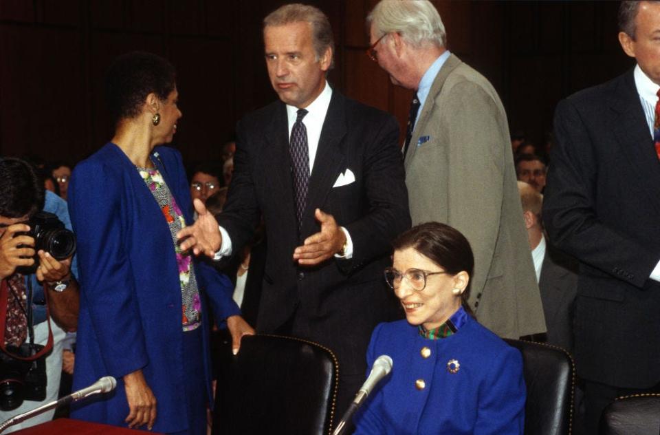 US Court of Appeals (for the District of Columbia) Judge Ruth Bader Ginsburg (1933 - 2020) (seated) prior to her Associate Justice of the US Supreme Court confirmation hearing before the US Senate Committee on the Judiciary on Capitol Hill, Washington DC, July 20, 1993. Standing behind her are, from left, Delegate Eleanor Holmes Norton, US Senate Committee on the Judiciary Chairman US Senator (and future US President) Joe Biden, and US Senator Daniel Patrick Moynihan (1927 - 2003).