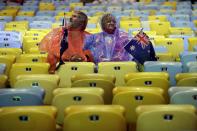 <p>Spectators wait in the rain for the start of the Summer Olympics closing ceremony inside Maracana stadium in Rio de Janeiro, Brazil, Sunday, Aug. 21, 2016. (AP Photo/Jae C. Hong) </p>
