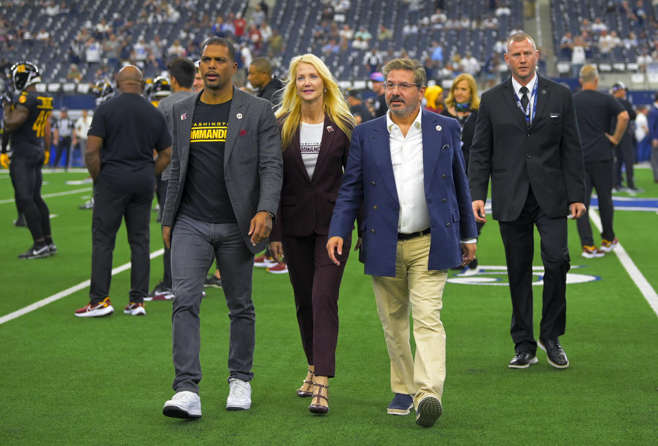 ARLINGTON, TX - OCTOBER 2:Washington Commanders President Jason Wright, Co-Chief Executive Officer Tanya Snyder and her husband owner Daniel Snyder walk off the field before the game between the Dallas Cowboys and the Washington Commanders at AT&T Stadium on October 2, 2022. (Photo by John McDonnell/The Washington Post via Getty Images)