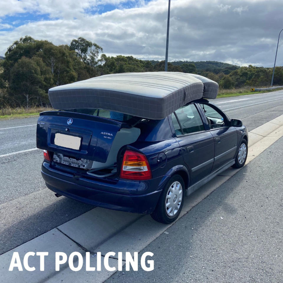 A washing machine was also found to be jammed in the back of the car. Source: ACT Policing