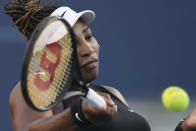 Serena Williams, of the United States, hits a return to Belinda Bencic, of Switzerland, during the National Bank Open tennis tournament Wednesday, Aug. 10, 2022, in Toronto. (Nathan Denette/The Canadian Press via AP)