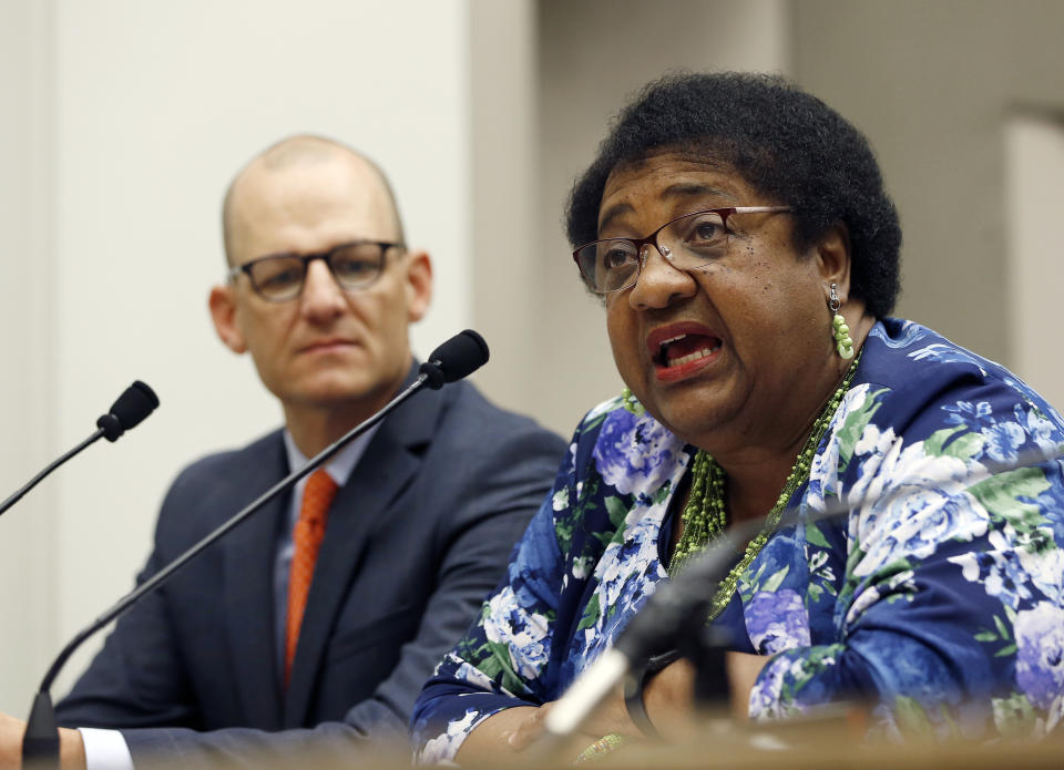 FILE - In this April 9, 2019 file photo Assemblywoman Shirley Weber, D-San Diego, discusses her proposed measure to limit the use of deadly force by police, as the bill's co-author, Assemblyman Kevin McCarty, D-Sacramento, left, listens during a hearing on the bill at the Capitol, in Sacramento, Calif. Major police organizations confirmed Thursday, May 23 2019, that they won't fight her bill, AB392, that would bar police from using lethal force unless it is necessary to prevent immediate harm to themselves or others. (AP Photo/Rich Pedroncelli, File)