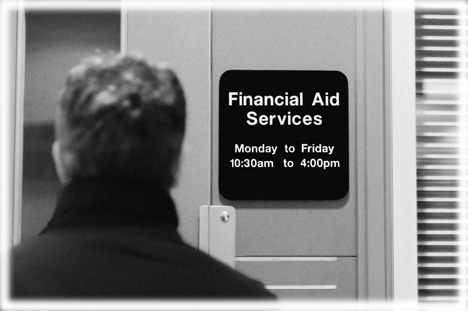 College student entering a financial aid services office