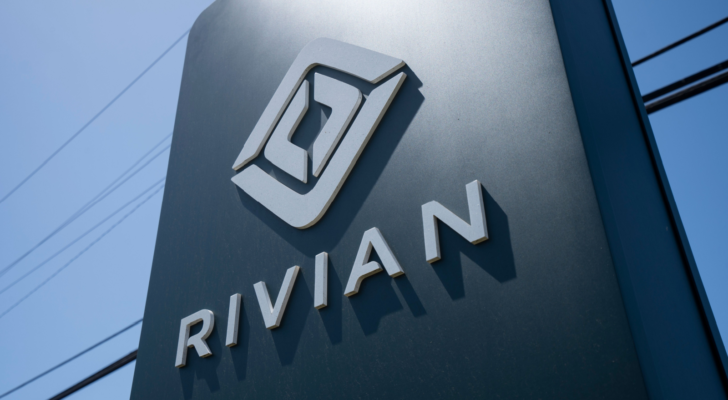 Rivian (RIVN) logo is seen at a Rivian service center in South San Francisco, California. Rivian Automotive, Inc. is an electric vehicle automaker.