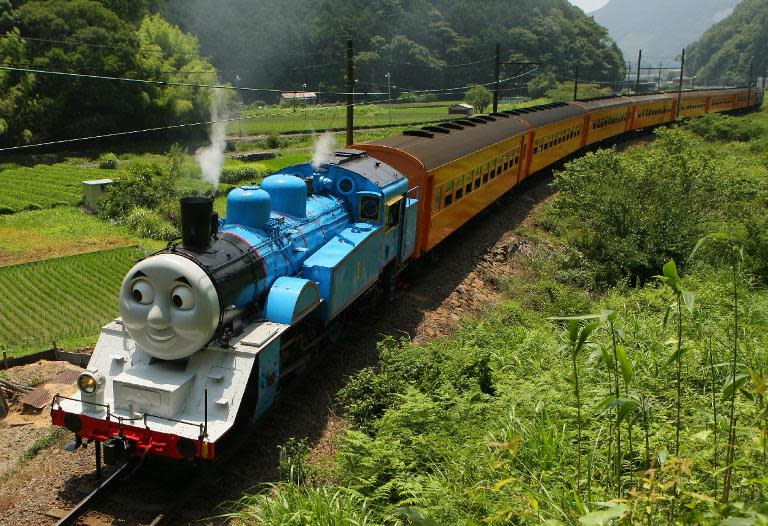 This picture taken on July 2, 2014 shows a life-sized Thomas the Tank Engine making a test run in the mountains on a line run by Japan's Oigawa railway near the city of Shimada in Shizuoka prefecture, west of Tokyo