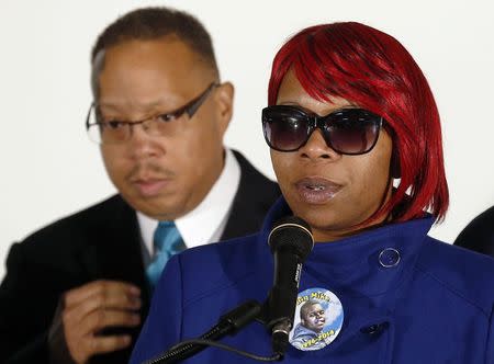 Lesley McSpadden (R), the mother of slain teenager Michael Brown, speaks after returning from a hearing of the Committee against Torture at the United Nations in Geneva as the family attorney Anthony Gray looks on, at the airport in St. Louis, Missouri, November 14, 2014. REUTERS/Jim Young