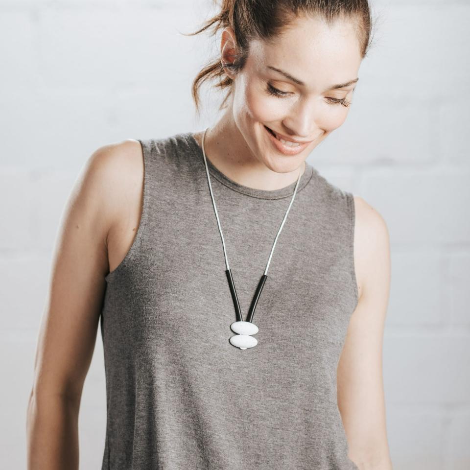 Model wears a teething necklace