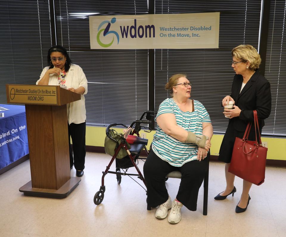 New York State Senator Shelley Mayer, right, chats with Cynde Stratton, an independent living advocate with the Putnam Independent Living Services, at the Westchester Disabled On the Move office in Yonkers, March 15, 2024. At left is Maria Samuels, the Executive Director of Westchester Disabled on the Move.