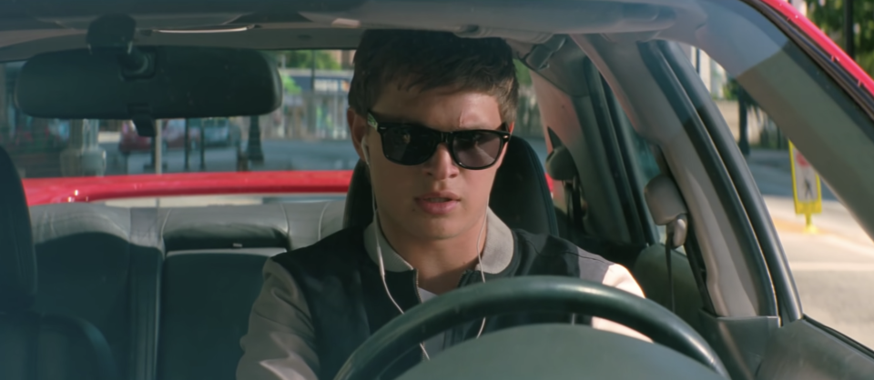Ansel Elgort as Baby in "Baby Driver" is sitting in the car