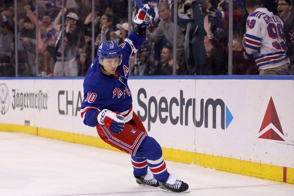 Feb 28, 2024; New York, New York, USA; New York Rangers left wing Artemi Panarin (10) celebrates a goal against the Columbus Blue Jackets by defenseman Adam Fox (not pictured) during the second period at Madison Square Garden.
