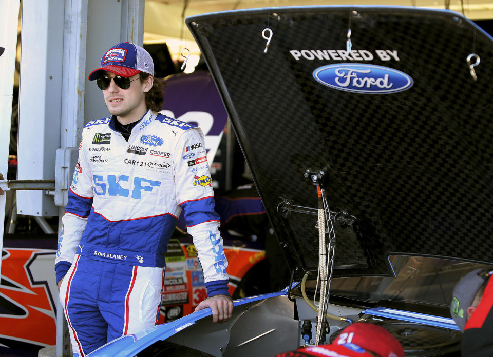 Ryan Blaney stands next to his race car before practice for the NASCAR Cup Series auto race at Phoenix International Raceway, Friday, Nov. 10, 2017, in Avondale, Ariz. Blaney is one of five drivers looking to fill the final spot for the Championship 4. (AP Photo/Ralph Freso)