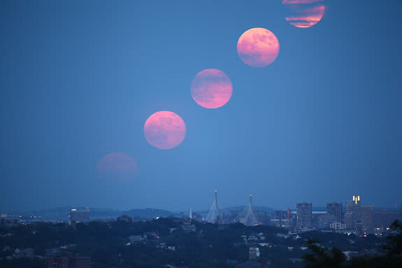 Experienced space photographers Edwin Aguirre and Imelda Joson created this composite view of the biggest full moon of 2013, a so-called 'supermoon,' from a series of images taken as the full moon rose over downtown Boston on June 23, 2013.