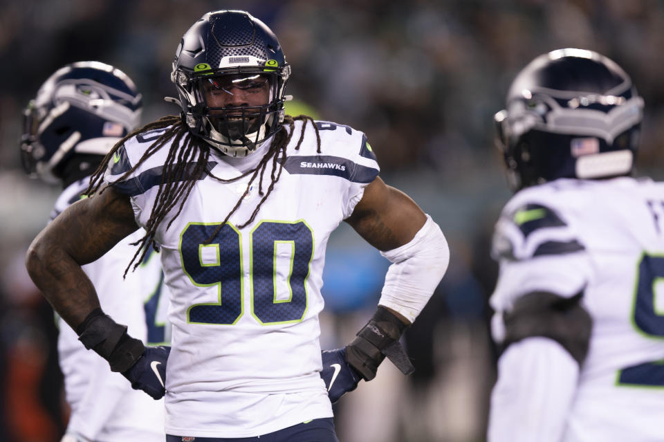 FILE - In this Sunday, Jan. 5, 2020 file photo, Seattle Seahawks defensive end Jadeveon Clowney (90) looks on during an NFL wild-card playoff football game against the Philadelphia Eagles in Philadelphia. The Browns are taking another run at Jadeveon Clowney. The free agent defensive end visited Cleveland on Wednesday, March 24, 2021 reviving a courtship that began last year before the No. 1 overall pick in 2014 signed with the Tennessee Titans. Because of the COVID-19 pandemic, the sides couldn't meet last year.(AP Photo/Chris Szagola, File)