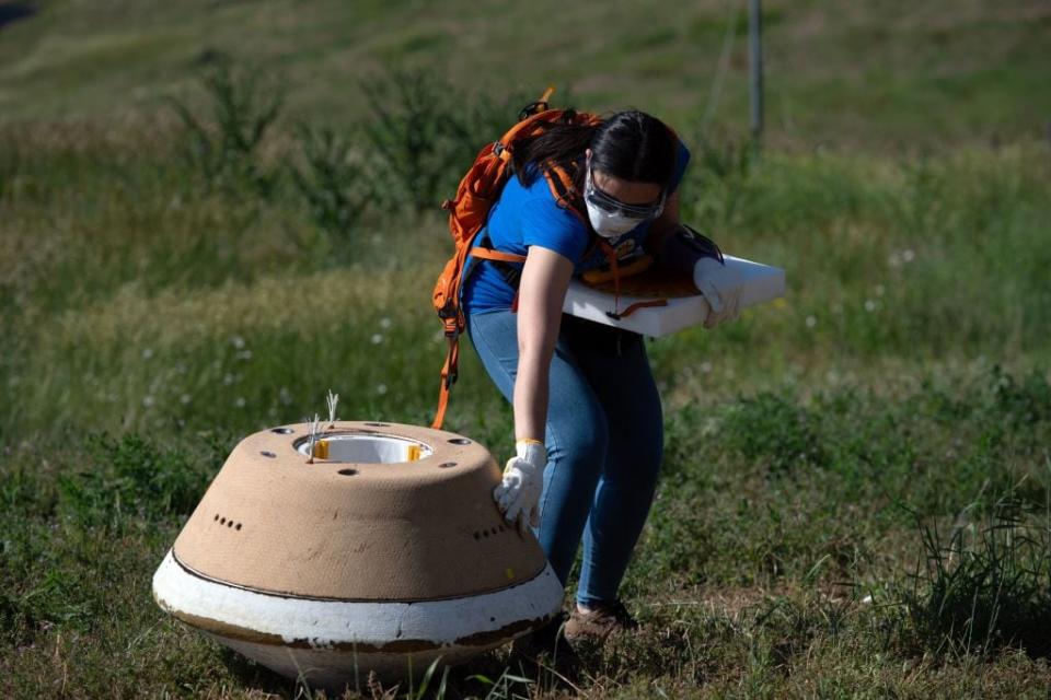 Victoria Thiem, Lockheed Martin System Safety Engineer conducts NASA's first major asteroid sample recovery rehearsal for its OSIRIS-REx (Origins, Spectral Interpretation, Resource Identification, and Security  Regolith Explorer) mission, at Lockheed Martin in Littleton, Colorado, on June 27, 2023. OSIRIS-REx is the first US mission to capture a sample from the surface of an asteroid. The delivery from asteroid Bennu will arrive on September 24, 2023, and is expected to help researchers study the origins of organics and water that could have led to life on Earth. (Photo by Jason Connolly / AFP) (Photo by JASON CONNOLLY/AFP via Getty Images)