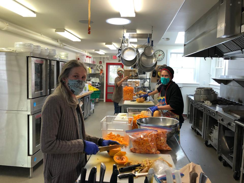 Island Grown Initiative volunteers process butternut squash for the organization's meals program in a "borrowed" kitchen. The nonprofit recently purchased Kitchen Porch Catering in Edgartown with a commercial-grade kitchen.