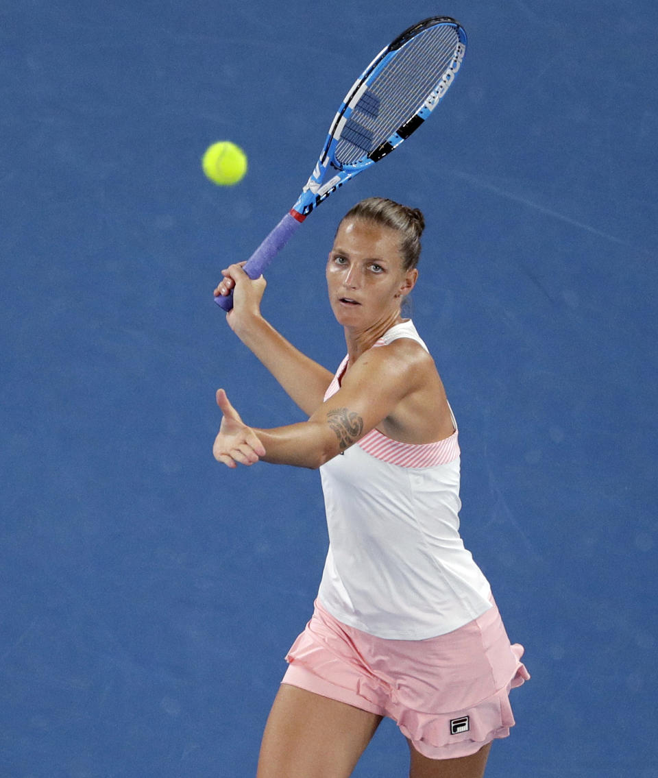 Karolina Pliskova of the Czech Republic makes a forehand return to Japan's Naomi Osaka during their semifinal at the Australian Open tennis championships in Melbourne, Australia, Thursday, Jan. 24, 2019. (AP Photo/Mark Schiefelbein)