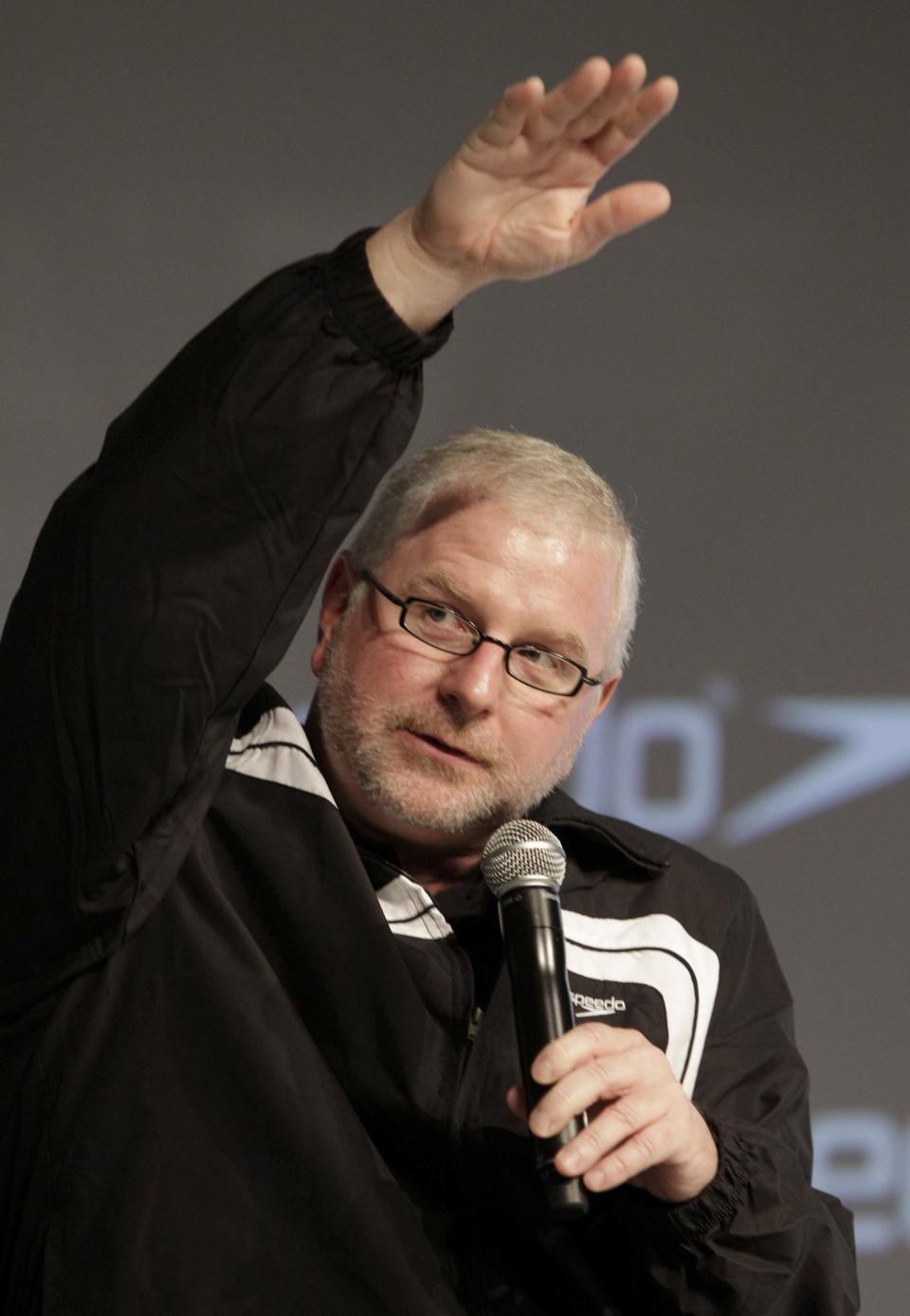 FILE - Bob Bowman, Michael Phelps coach, gestures during a news conference in New York, Nov. 30, 2011. While Bowman may have turned down his voice level, he's not gone all soft. (AP Photo/Kathy Willens, File)