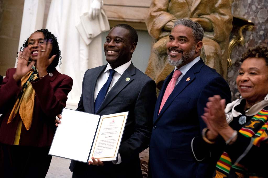 US Representative Gabe Amo (D-RI) (C), the first Black representative from Rhode Island, is sworn in as the 60th member of the Congressional Black Caucus in Statuary Hall at the US Capitol in Washington, DC, on November 14, 2023. Amo is replacing former US Representative David Cicilline, who resigned from Congress to become president and CEO of the Rhode Island Foundation. (Photo by Stefani Reynolds / AFP) (Photo by STEFANI REYNOLDS/AFP via Getty Images)