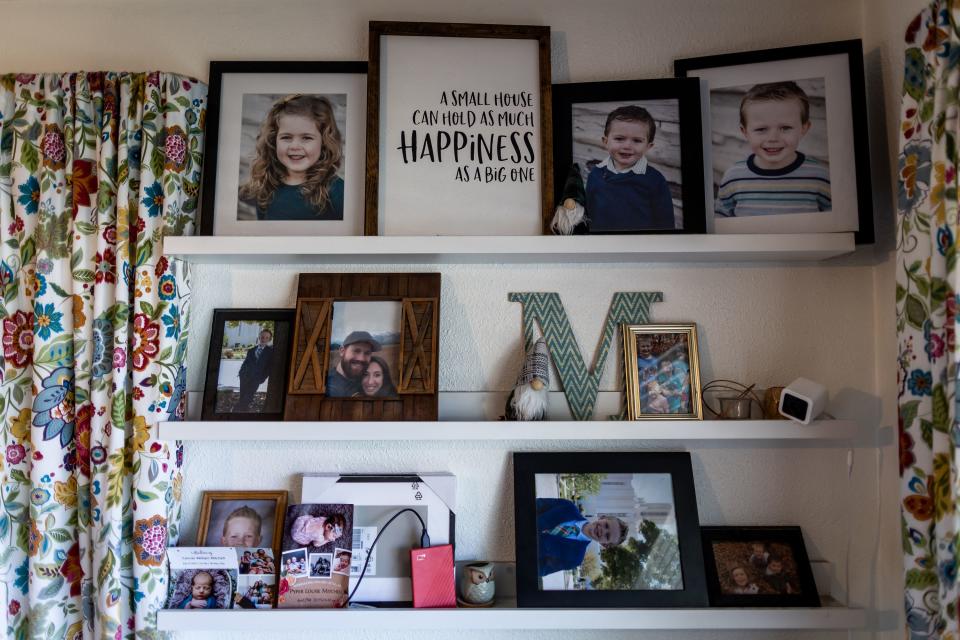 Pictures adorn shelves at Josh and Aubrey Mitchell’s home in Midvale on Tuesday, May 30, 2023. | Spenser Heaps, Deseret News