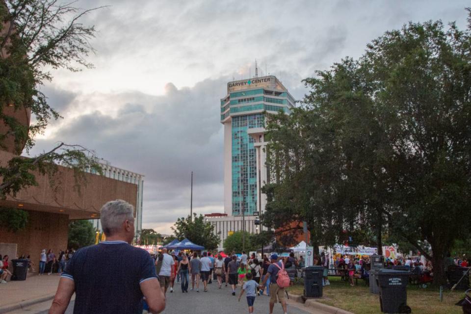 Riverfest attendees walk around Century II on the first night of the nine-day festival.
