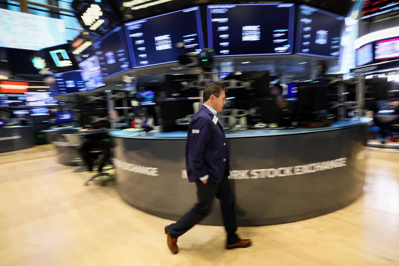 Traders work on the floor of the NYSE in New York