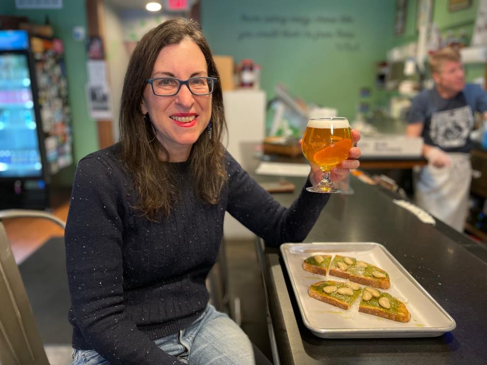 Enjoying a beer and pesto toast at Run & Hide Brewing Co. in Port Chester. Photographed April 2024