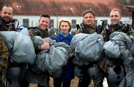 FILE PHOTO: German Defence Minister Ursula von der Leyen poses for a picture with paratroopers at the Franz-Josef Strauss Bundeswehr armybase in Altenstadt, Germany, February 3, 2017. REUTERS/Michael Dalder/File Photo