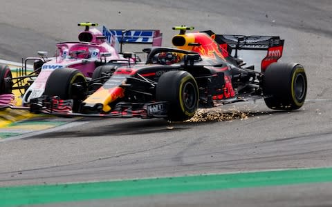 Max Verstappen collides with Esteban Ocon - Credit: Getty