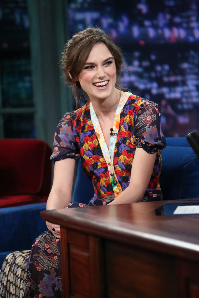 Keira Knightley laughs at a talk show