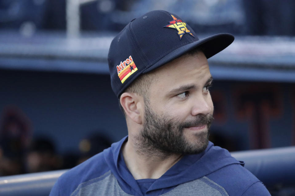 Houston Astros second baseman Jose Altuve (27) waits for a spring training baseball game against the Washington Nationals the start Saturday, Feb. 22, 2020, in West Palm Beach, Fla. (AP Photo/John Bazemore)