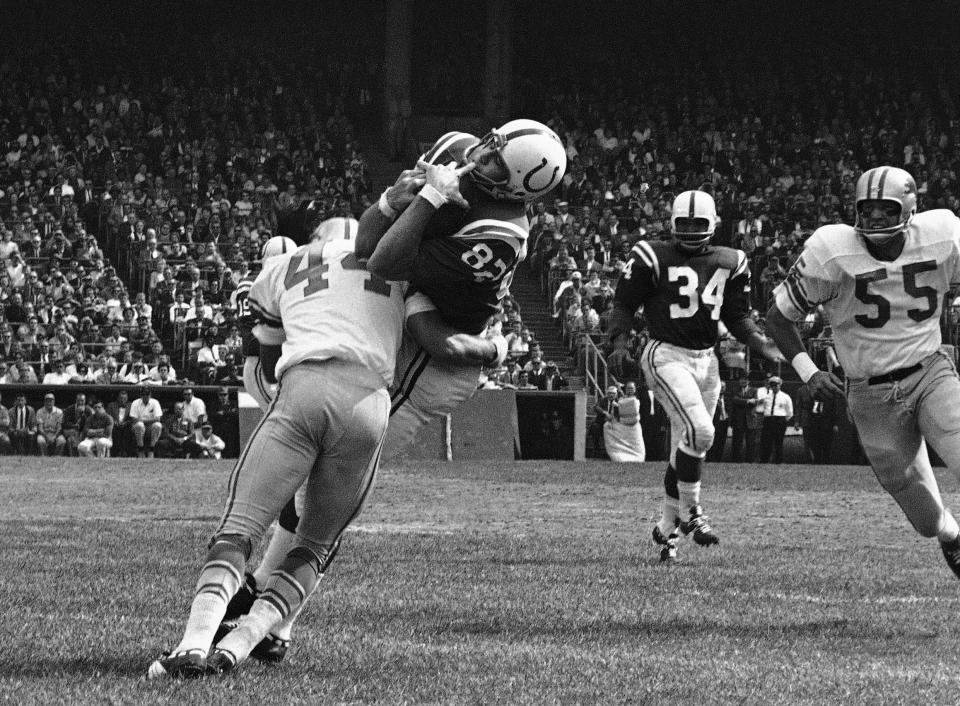 Lions cornerback Dick LeBeau tackles Colts end Raymond Berry, who caught a 5-yard pass from quarterback Johnny Unitas, Sept. 30, 1962, in Baltimore. All three men ended up in the Pro Football Hall of Fame.