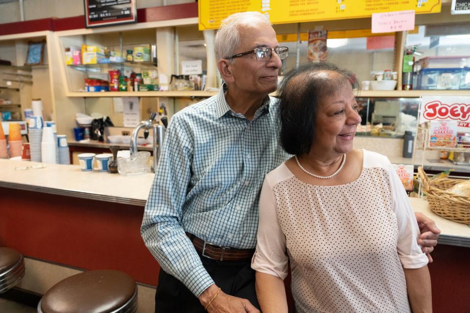 Virendra Dave, standing next to his wife, Harsha, is closing his convenience store after 40 years of being a staple on the corner of Main Ave and Brook Ave in Passaic, NJ.