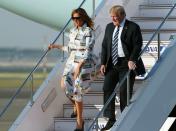 <p>Melania battled the wind while exiting Air Force One in Japan wearing this Calvin Klein button-up dress with an eye-catching motif back in May 2019.</p>