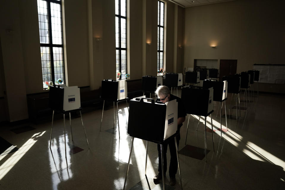 A person votes during Election Day, Tuesday, Nov. 7, 2023, at Knox Presbyterian Church in Cincinnati. Polls are open in a few states for off-year elections that could give hints of voter sentiment ahead of next year's critical presidential contest. (AP Photo/Joshua A. Bickel)