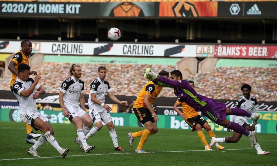 Fulham goalkeeper Alphonse Areola, who put in an excellent performance for the losing side, punches away as Wolves attack in the penalty area at Molineux.