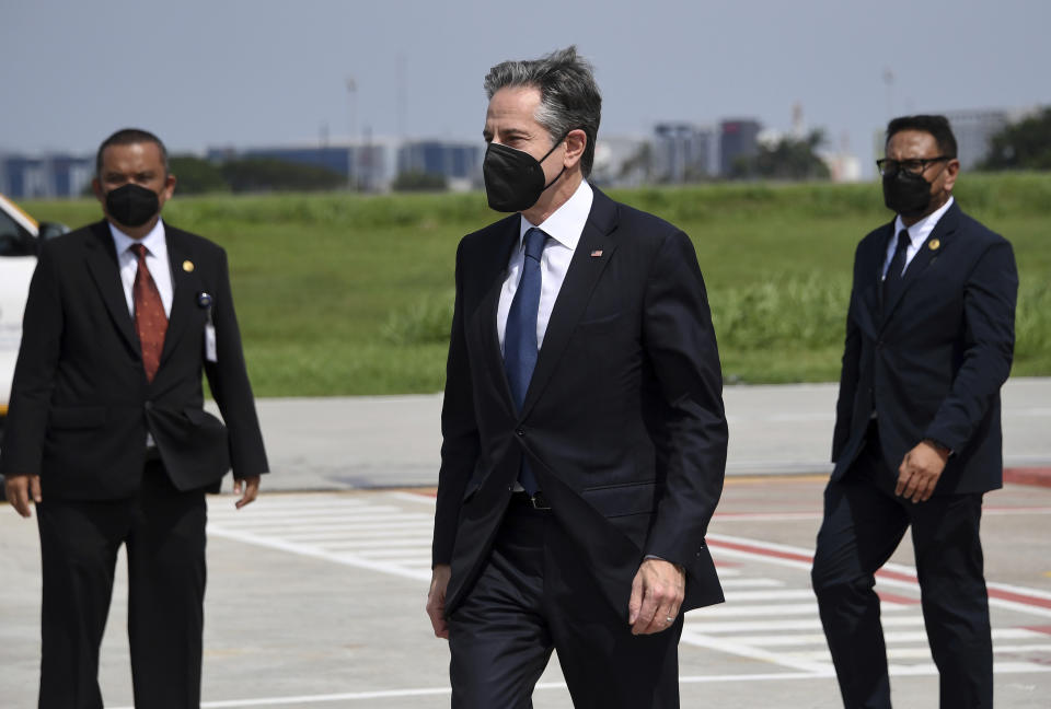 U.S. Secretary of State Antony Blinken, center, arrives at the international airport in Jakarta on Monday, Dec. 13, 2021. Blinken arrives in Indonesia on his first stop of a three-nation tour across Southeast Asia. (Olivier Douliery/Pool Photo via AP)