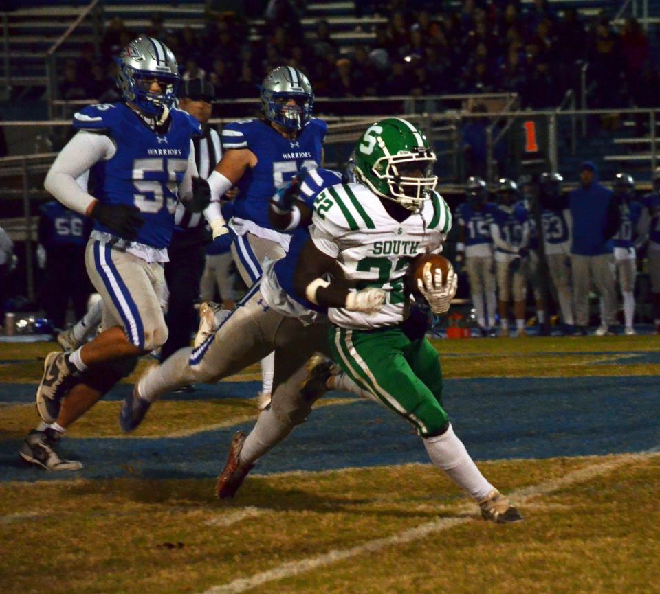 South Hagerstown's JoJo Davis carries the ball against Sherwood during their Class 3A West first-round playoff game.