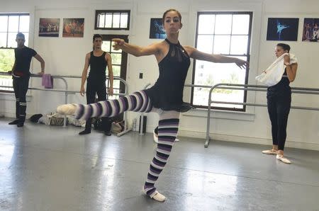 Monica Gomez and half dozen dancers from the National Ballet of Cuba who defected after a performance in Puerto Rico rehearse for an upcoming performance shortly before a news conference in Miami, Florida June 10, 2014. REUTERS/Gaston De Cardenas